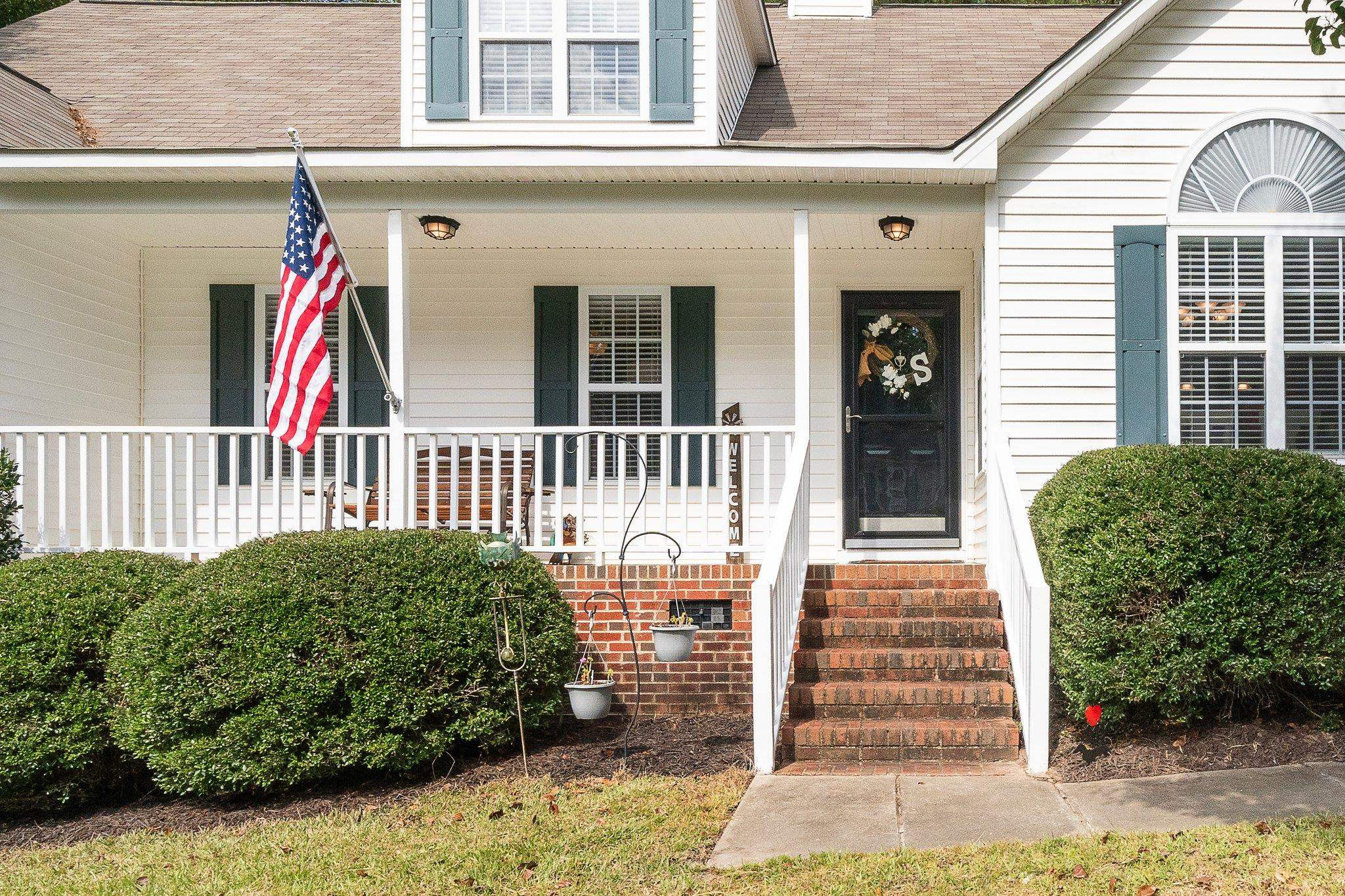 1904 Middle Ridge Drive Willow Spring, NC 27592 - Photo 6 of 34 The porch railings were just painted.