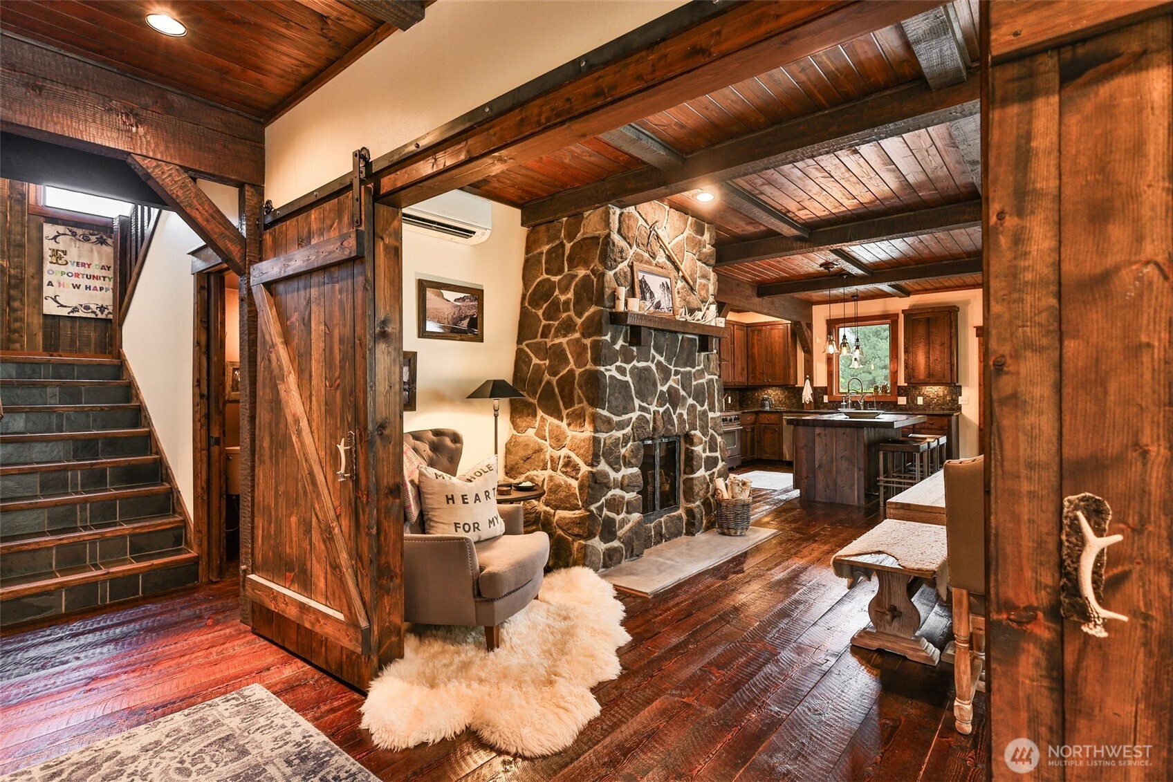 8105 Icicle Road Leavenworth, WA 98826 - Photo 12 of 40 a view of a hallway with wooden floor and windows