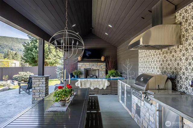 a front view of a house with outdoor seating