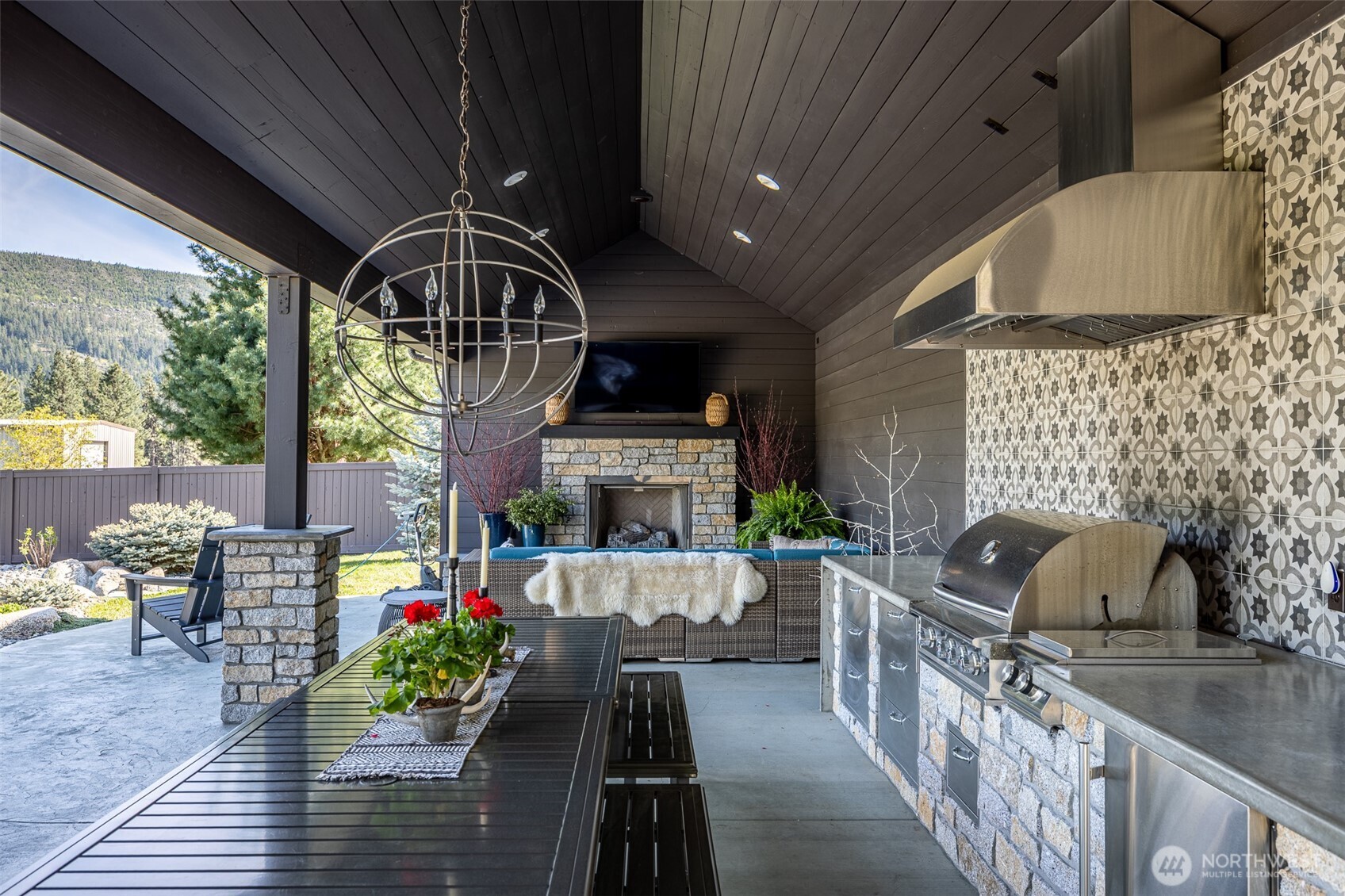 8105 Icicle Road Leavenworth, WA 98826 - Photo 18 of 40 a front view of a house with outdoor seating