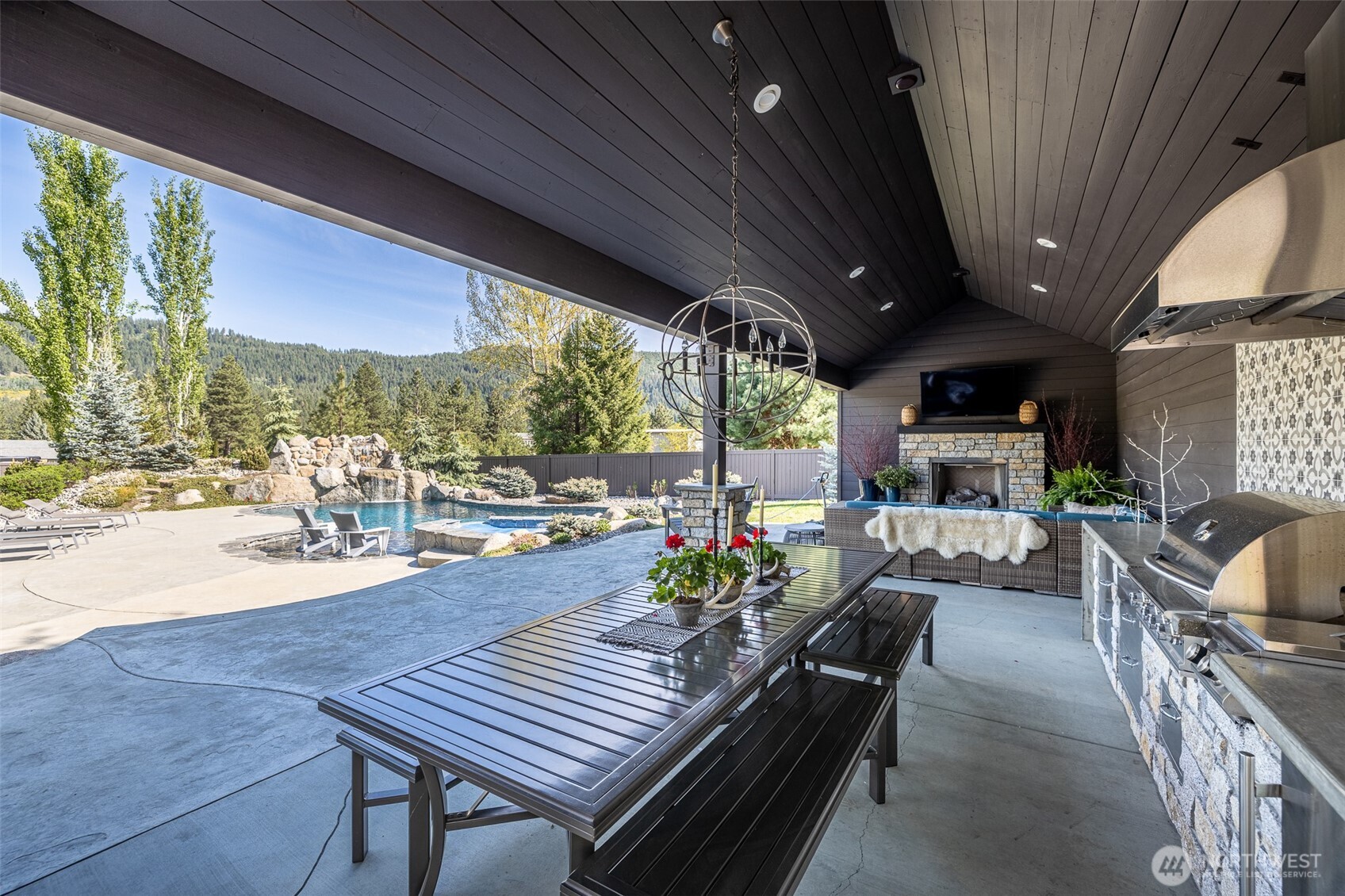 8105 Icicle Road Leavenworth, WA 98826 - Photo 19 of 40 a outdoor space with patio the couches and a dining table with chairs