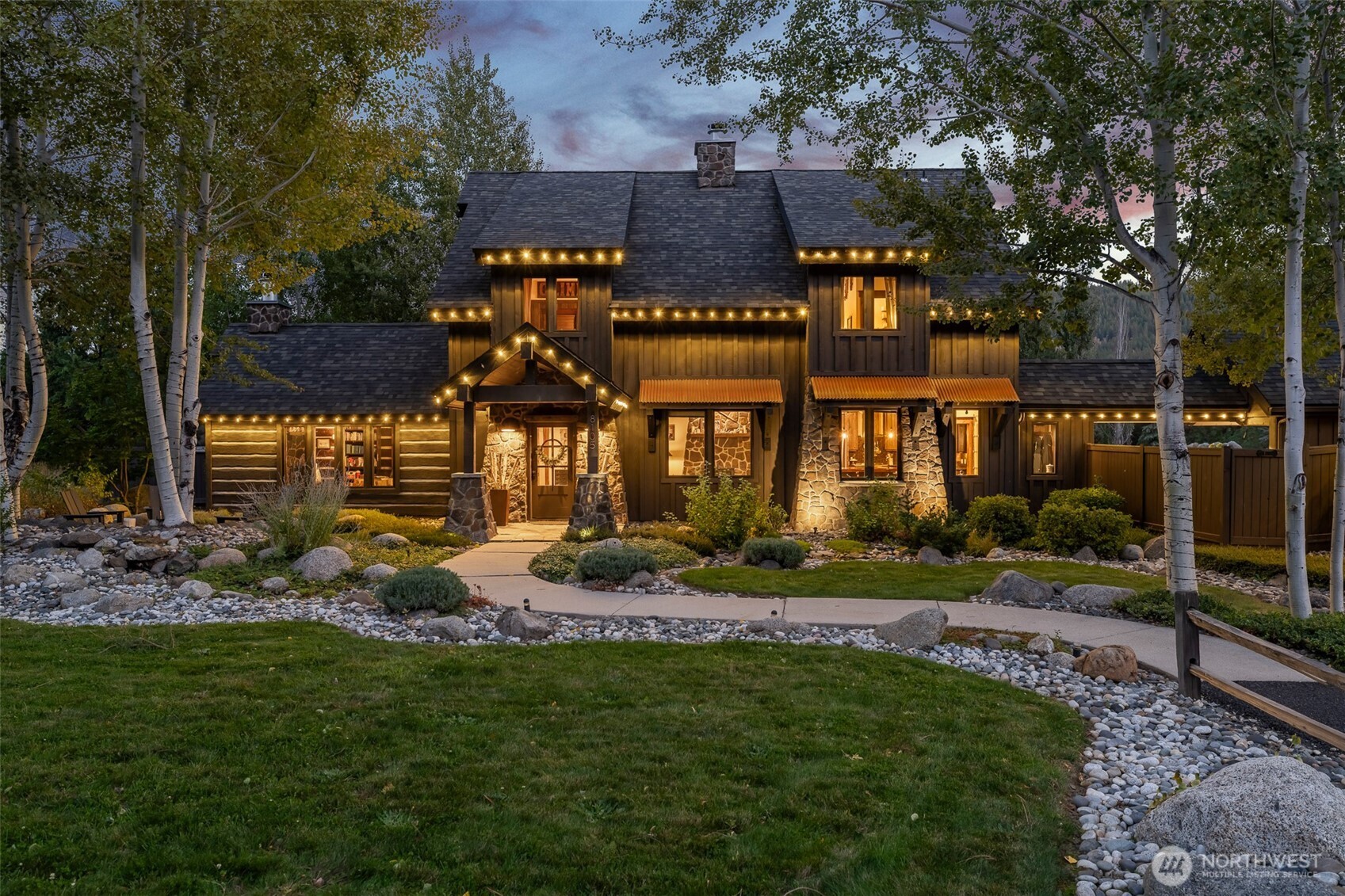 8105 Icicle Road Leavenworth, WA 98826 - Photo 2 of 40 a view of a house with backyard and sitting area