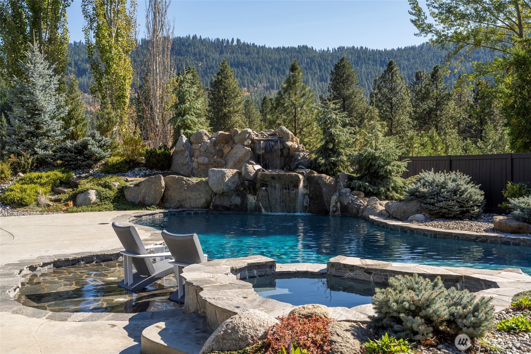 8105 Icicle Road Leavenworth, WA 98826 - Photo 21 of 40 a view of a lake with couches and city view