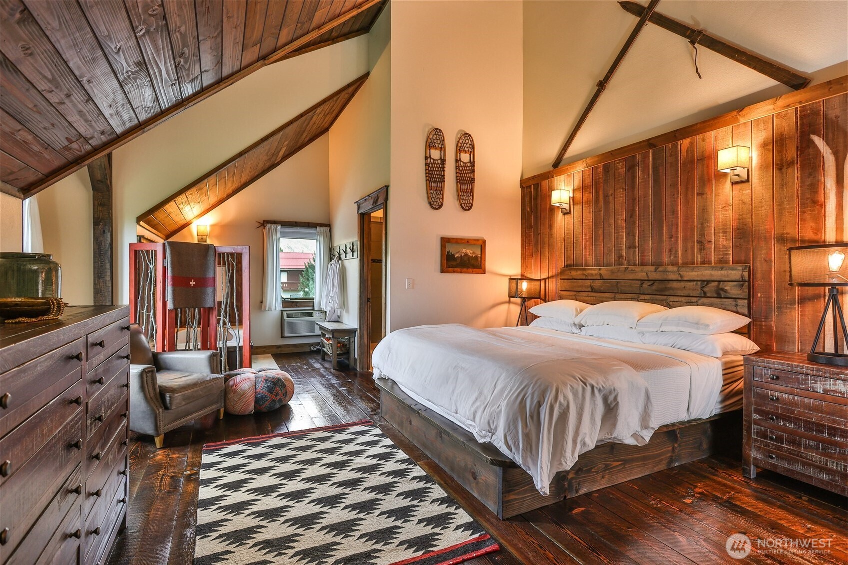 8105 Icicle Road Leavenworth, WA 98826 - Photo 28 of 40 a bedroom with a bed and wooden floor