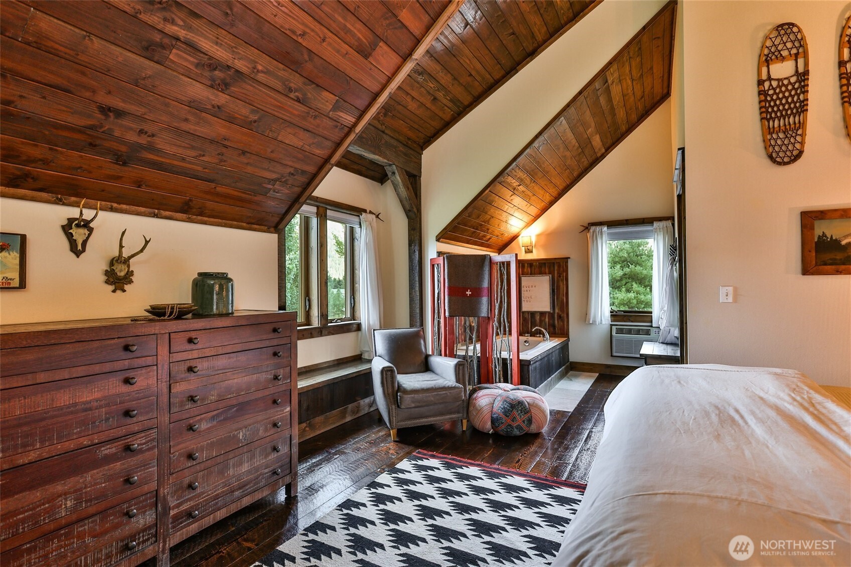 8105 Icicle Road Leavenworth, WA 98826 - Photo 29 of 40 a bedroom with furniture and a large window