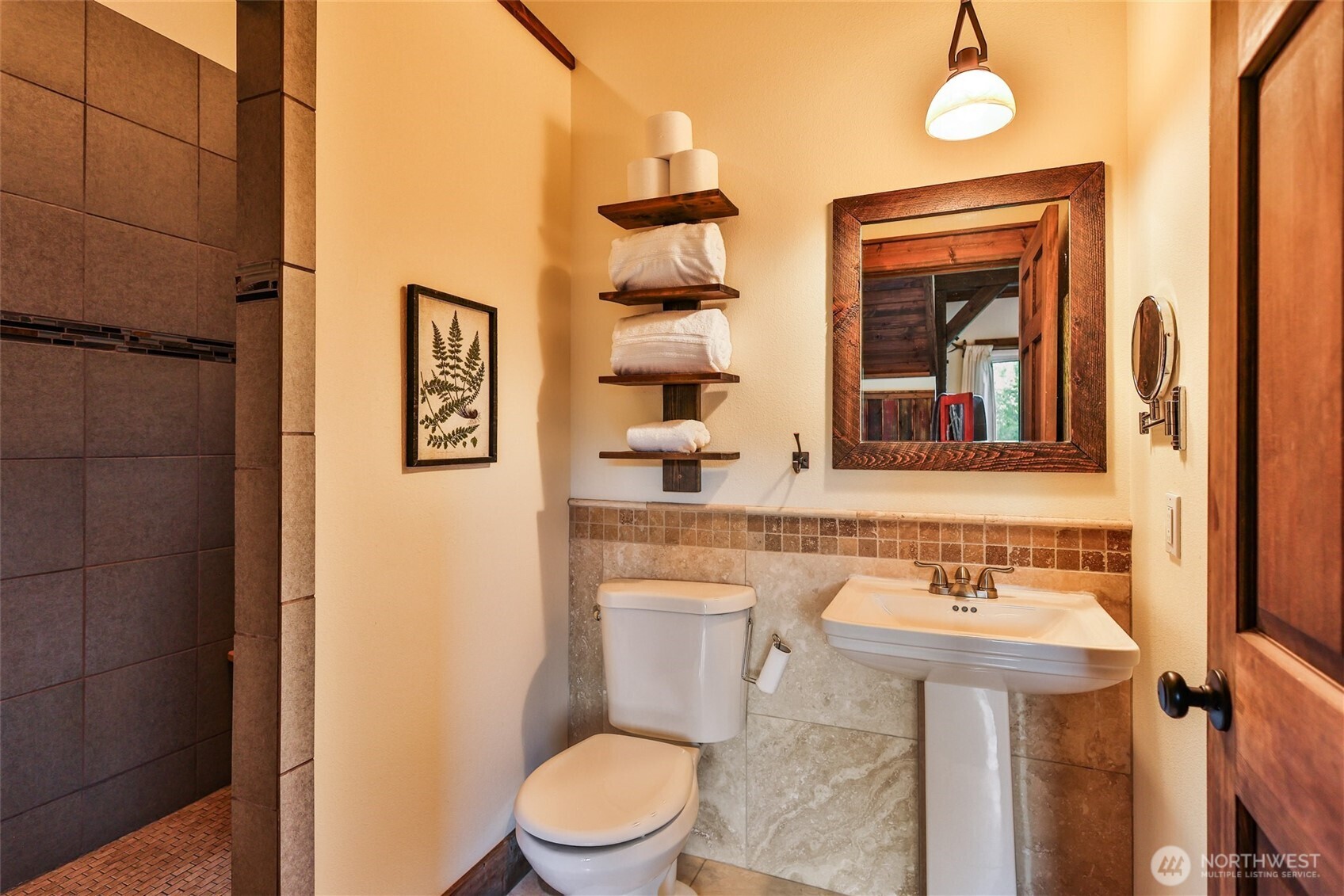 8105 Icicle Road Leavenworth, WA 98826 - Photo 30 of 40 a bathroom with a toilet a sink and mirror