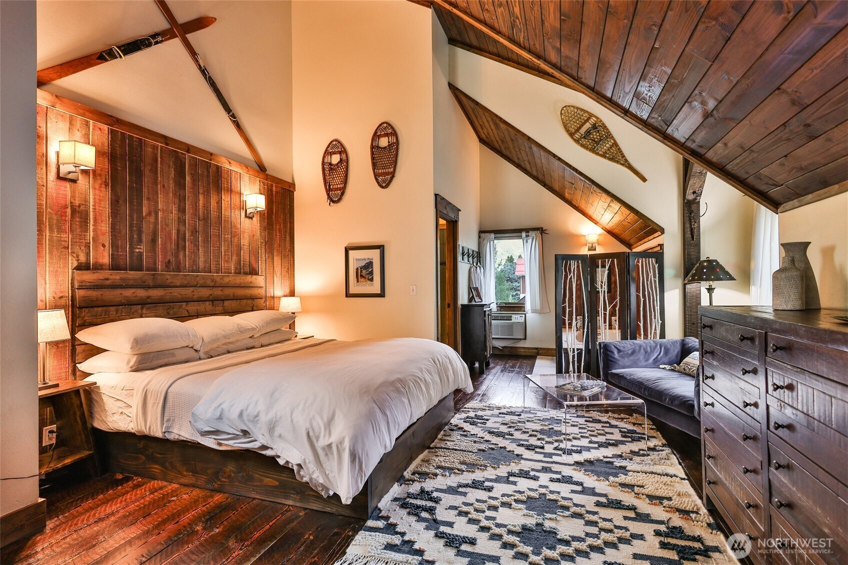 8105 Icicle Road Leavenworth, WA 98826 - Photo 31 of 40 a bedroom with bed and wooden floor