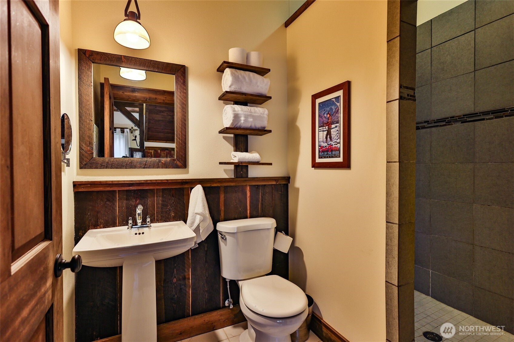 8105 Icicle Road Leavenworth, WA 98826 - Photo 32 of 40 a bathroom with a toilet a sink and mirror