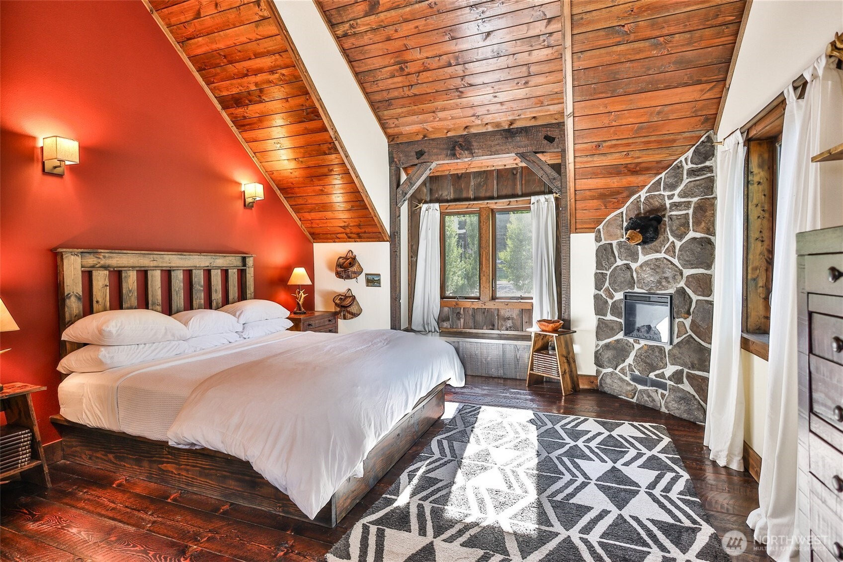 8105 Icicle Road Leavenworth, WA 98826 - Photo 34 of 40 a bedroom with a bed next to a window and a shower