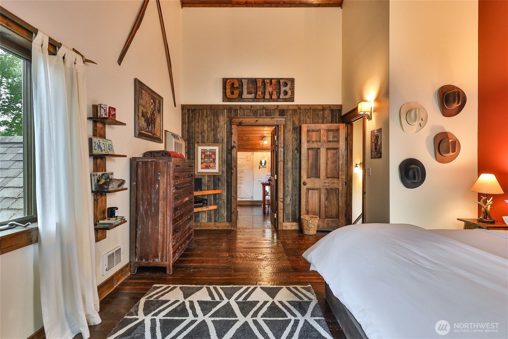 8105 Icicle Road Leavenworth, WA 98826 - Photo 35 of 40 a view of a bedroom with wooden floor and windows