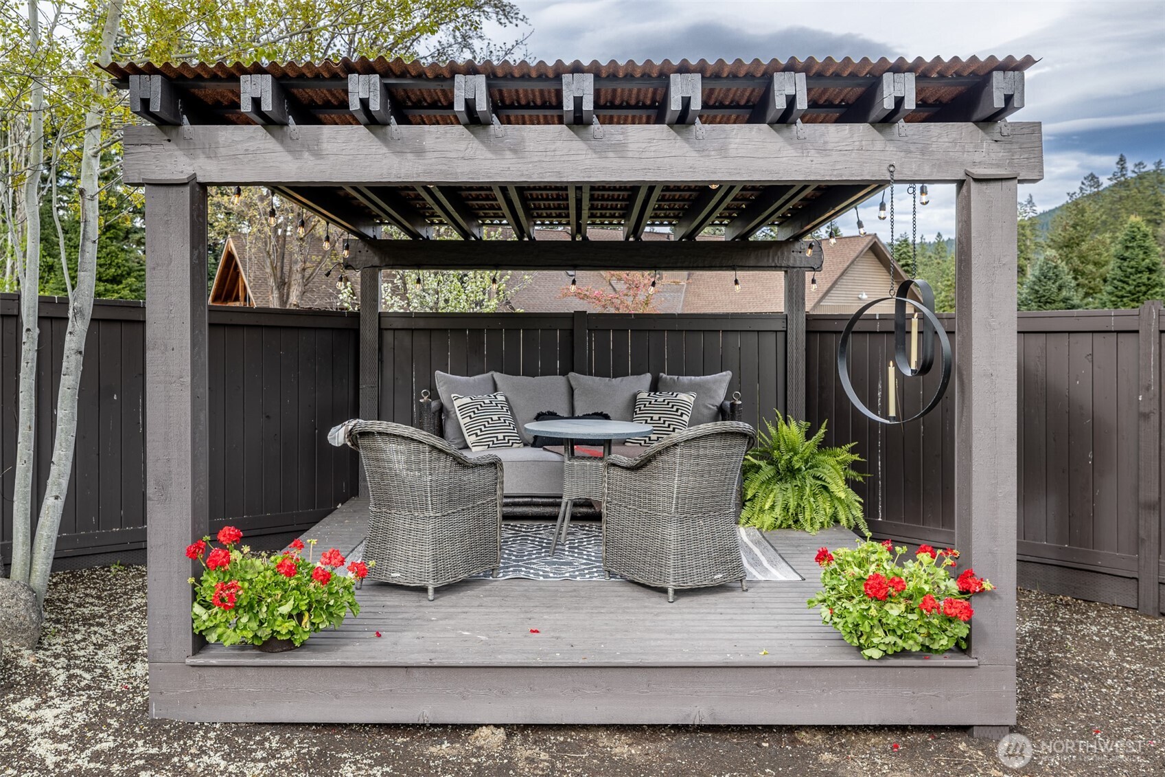 8105 Icicle Road Leavenworth, WA 98826 - Photo 37 of 40 a patio with table and chairs potted plants