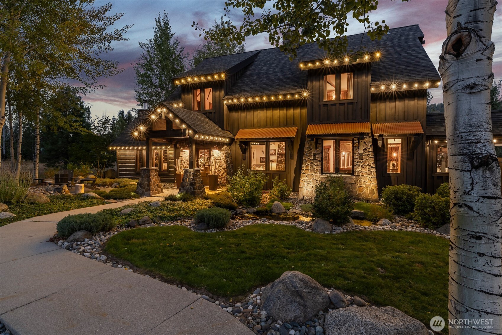 8105 Icicle Road Leavenworth, WA 98826 - Photo 39 of 40 a view of a house with a yard porch and sitting area
