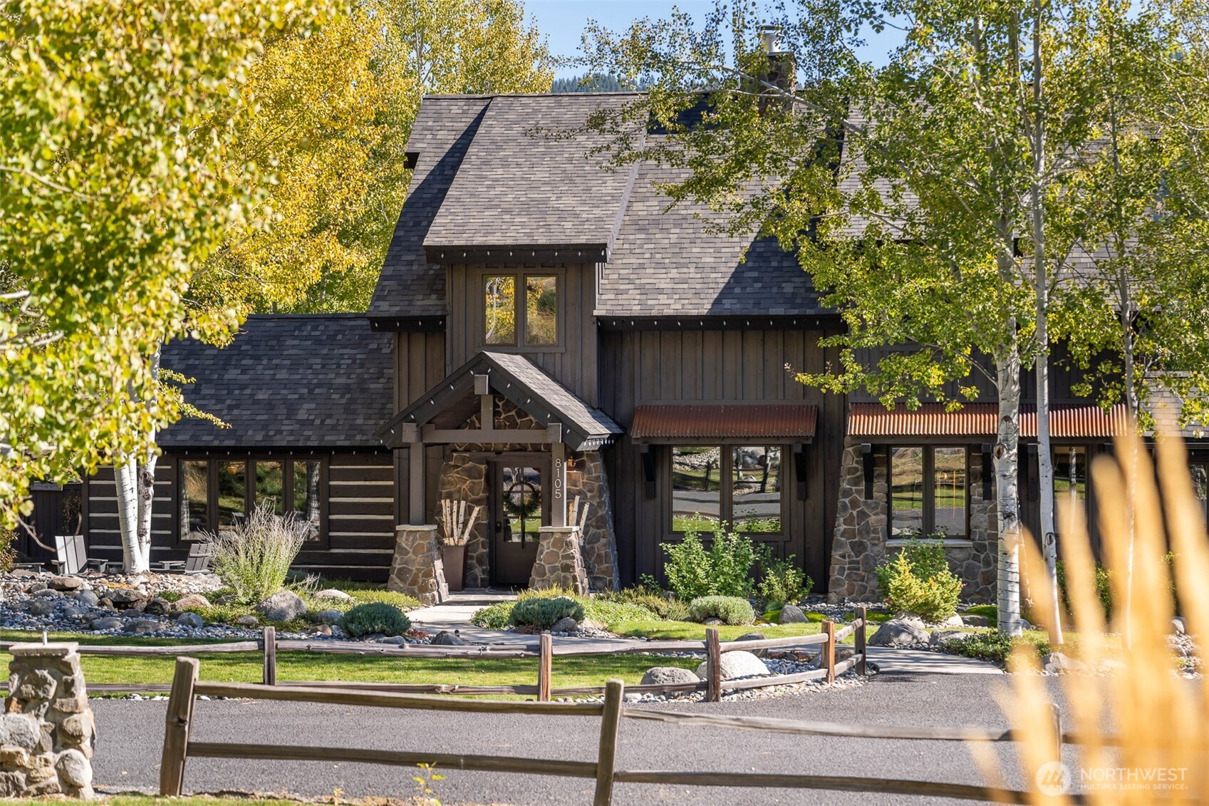8105 Icicle Road Leavenworth, WA 98826 - Photo 4 of 40 a front view of a house with porch and livingroom