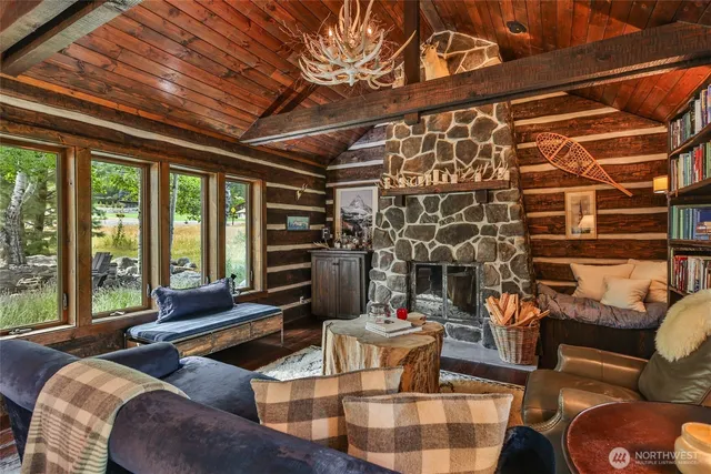 a bedroom with furniture and a large window