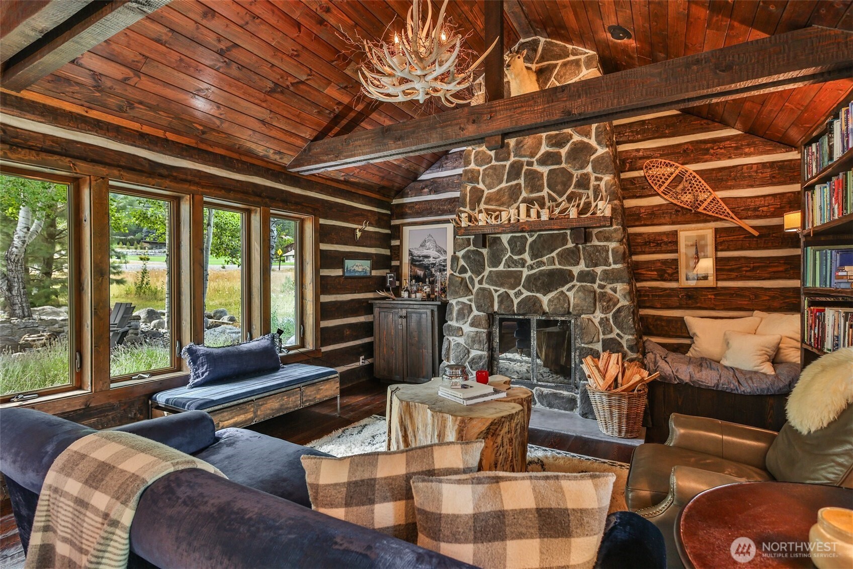 8105 Icicle Road Leavenworth, WA 98826 - Photo 10 of 40 a bedroom with furniture and a large window