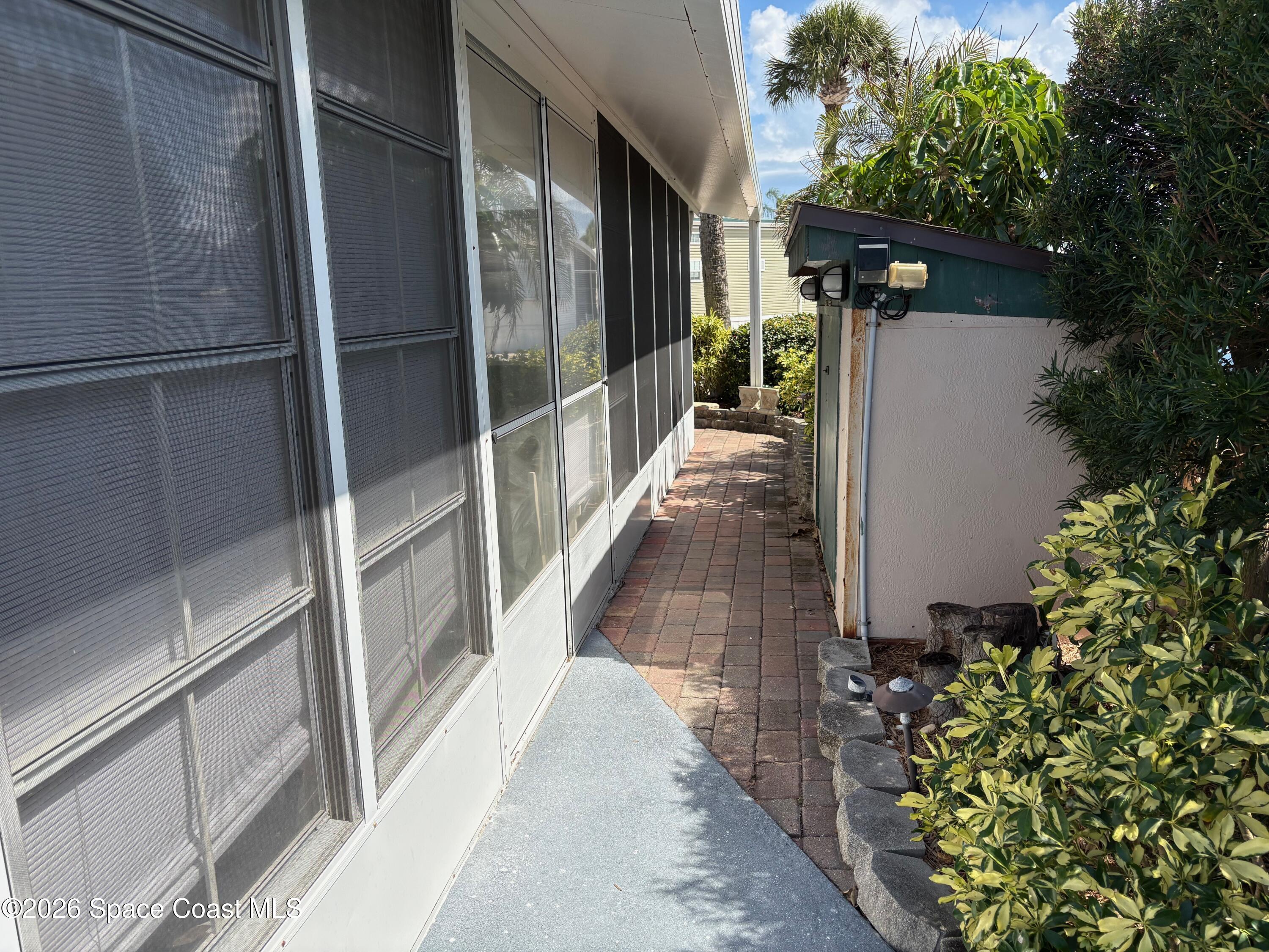 2912 Dockside Lane, Unit 2 Melbourne Beach, FL 32951 - Photo 13 of 66 a view of a pathway of a house