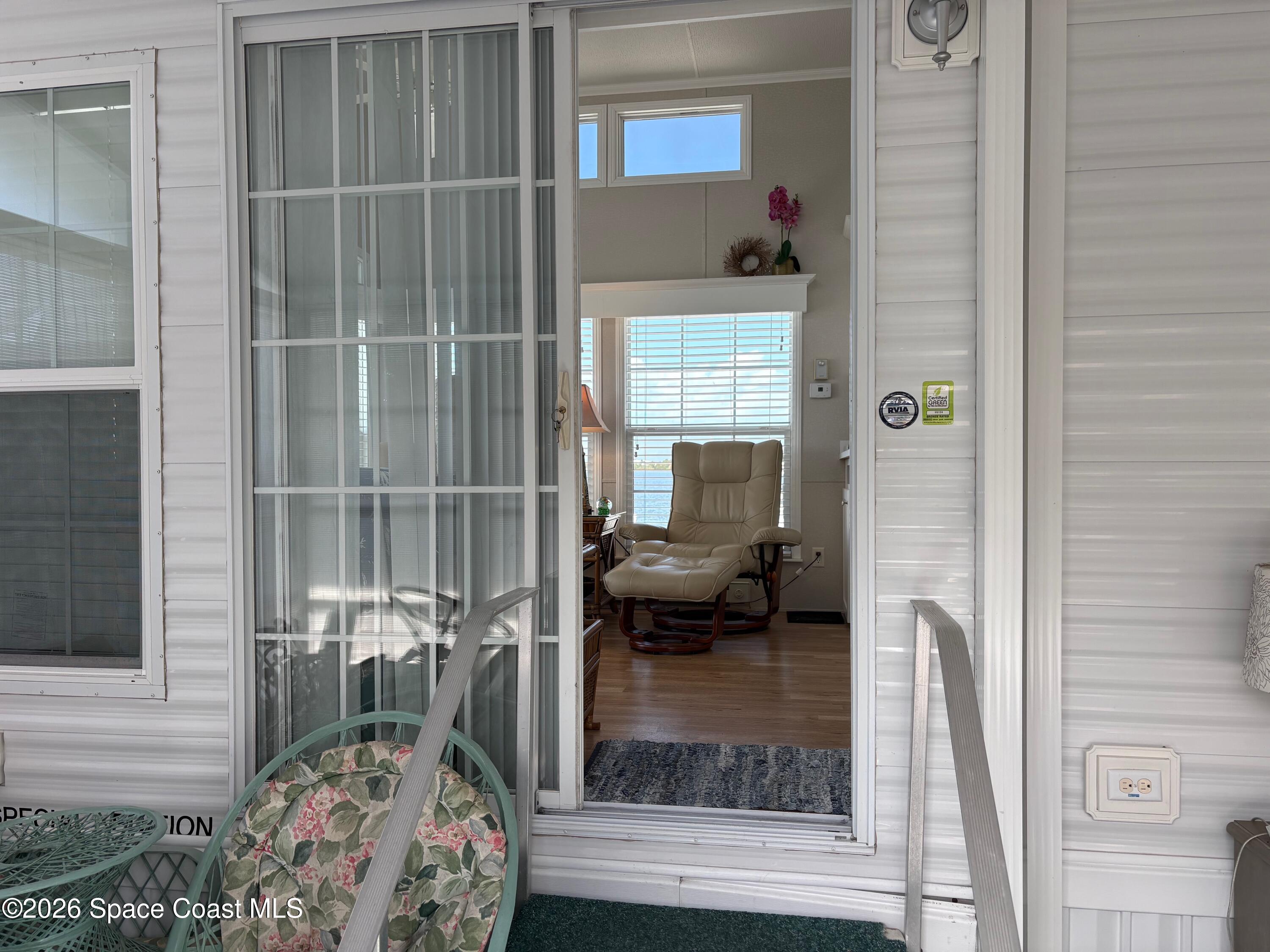 2912 Dockside Lane, Unit 2 Melbourne Beach, FL 32951 - Photo 15 of 66 a living room with furniture and a potted plant
