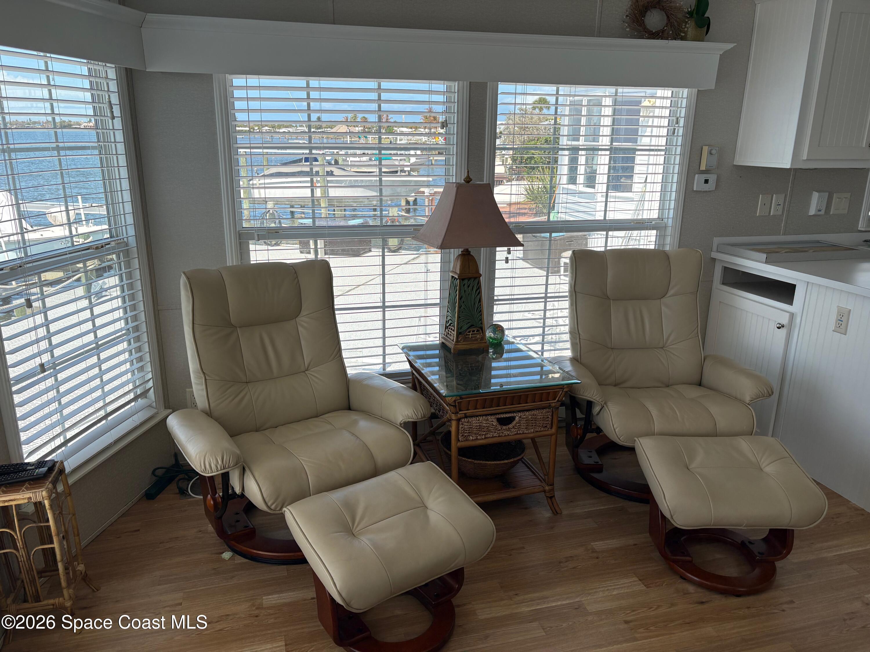 2912 Dockside Lane, Unit 2 Melbourne Beach, FL 32951 - Photo 18 of 66 a living room with furniture and a large window
