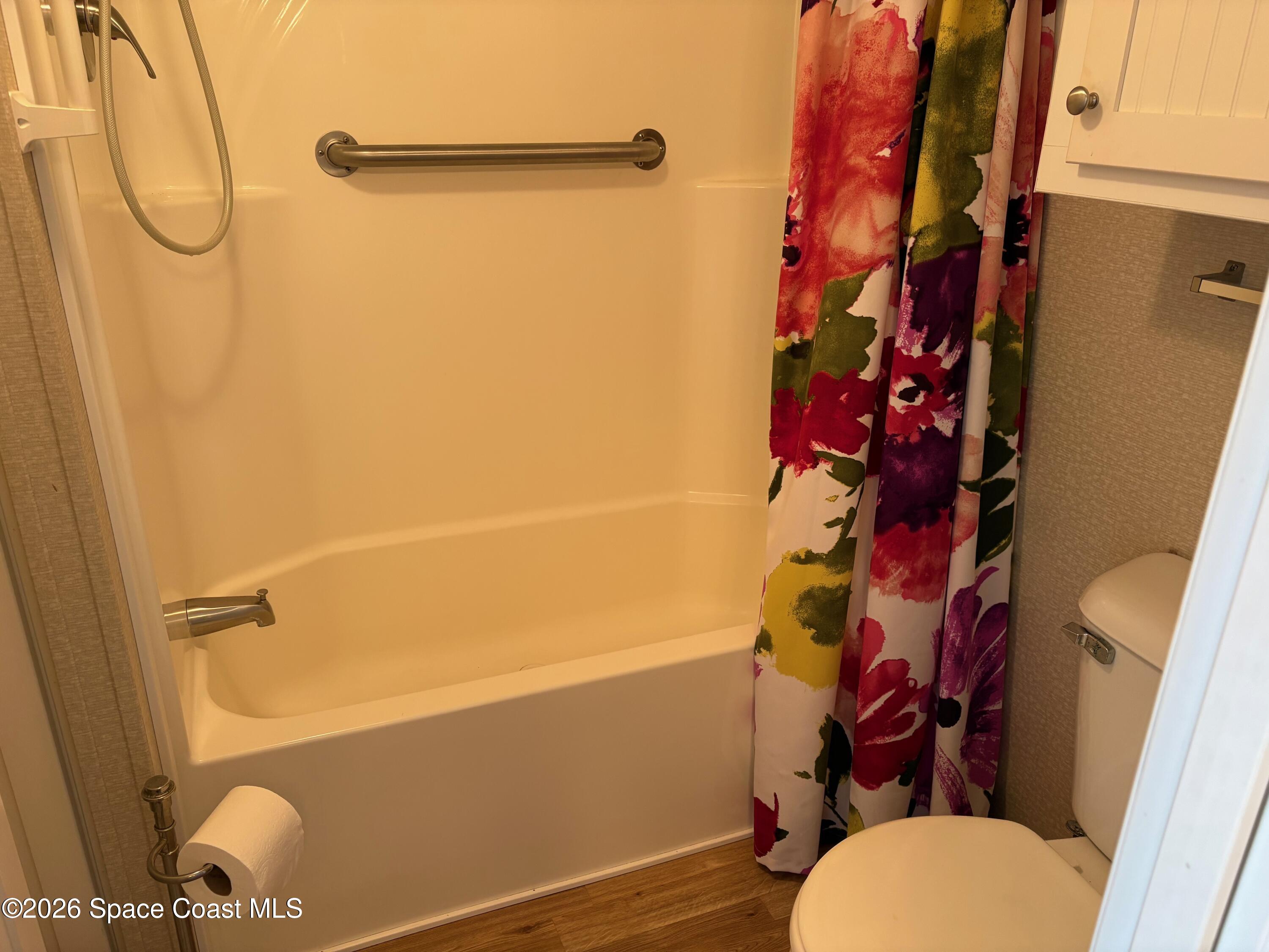 2912 Dockside Lane, Unit 2 Melbourne Beach, FL 32951 - Photo 27 of 66 a bathroom with a shower curtain