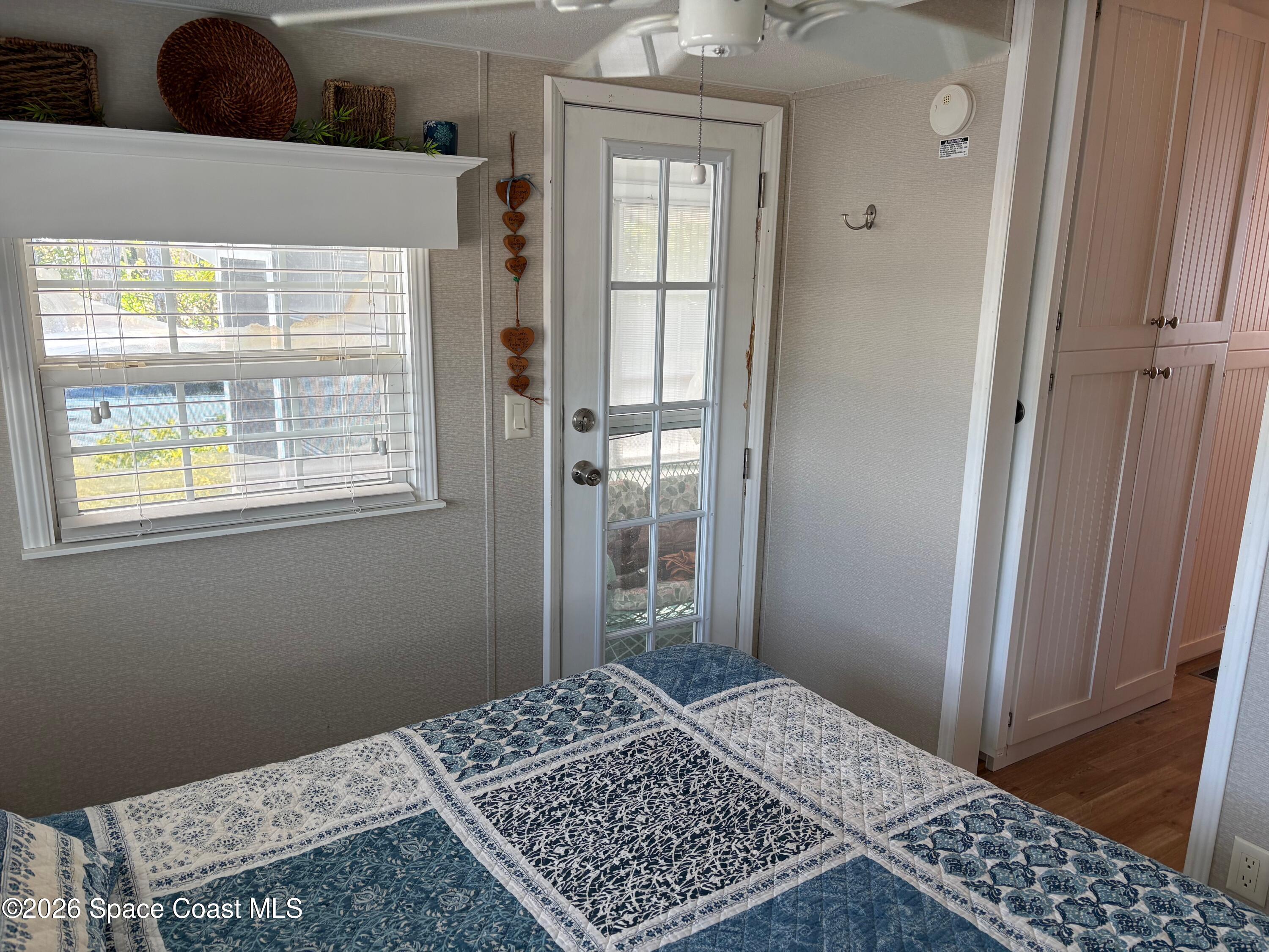 2912 Dockside Lane, Unit 2 Melbourne Beach, FL 32951 - Photo 32 of 66 a bedroom with a bed and a window