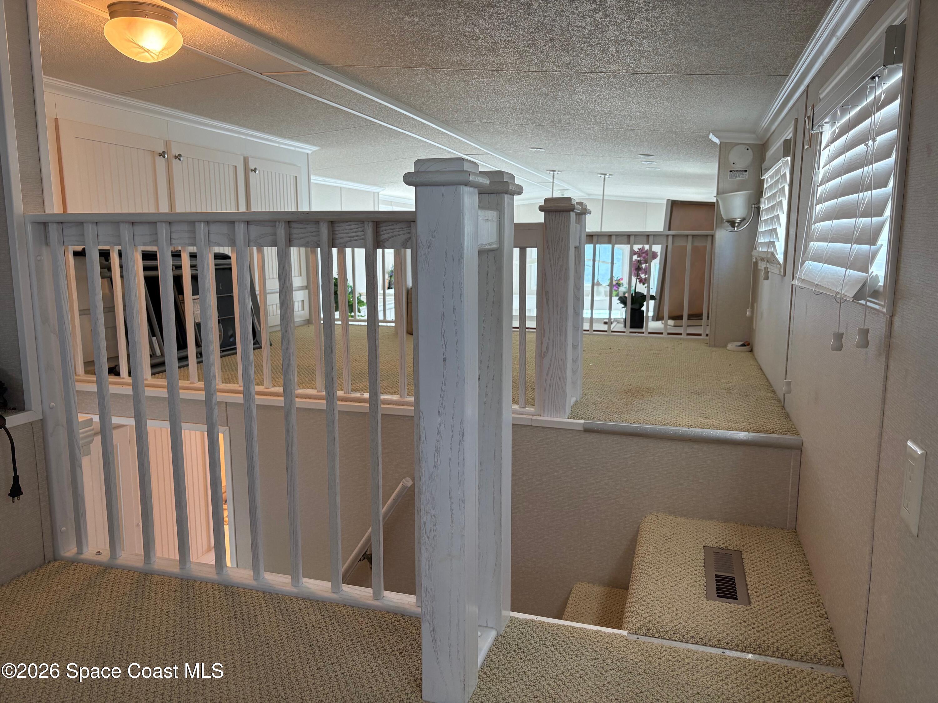 2912 Dockside Lane, Unit 2 Melbourne Beach, FL 32951 - Photo 36 of 66 a view of walk in closet with clothes and shoes