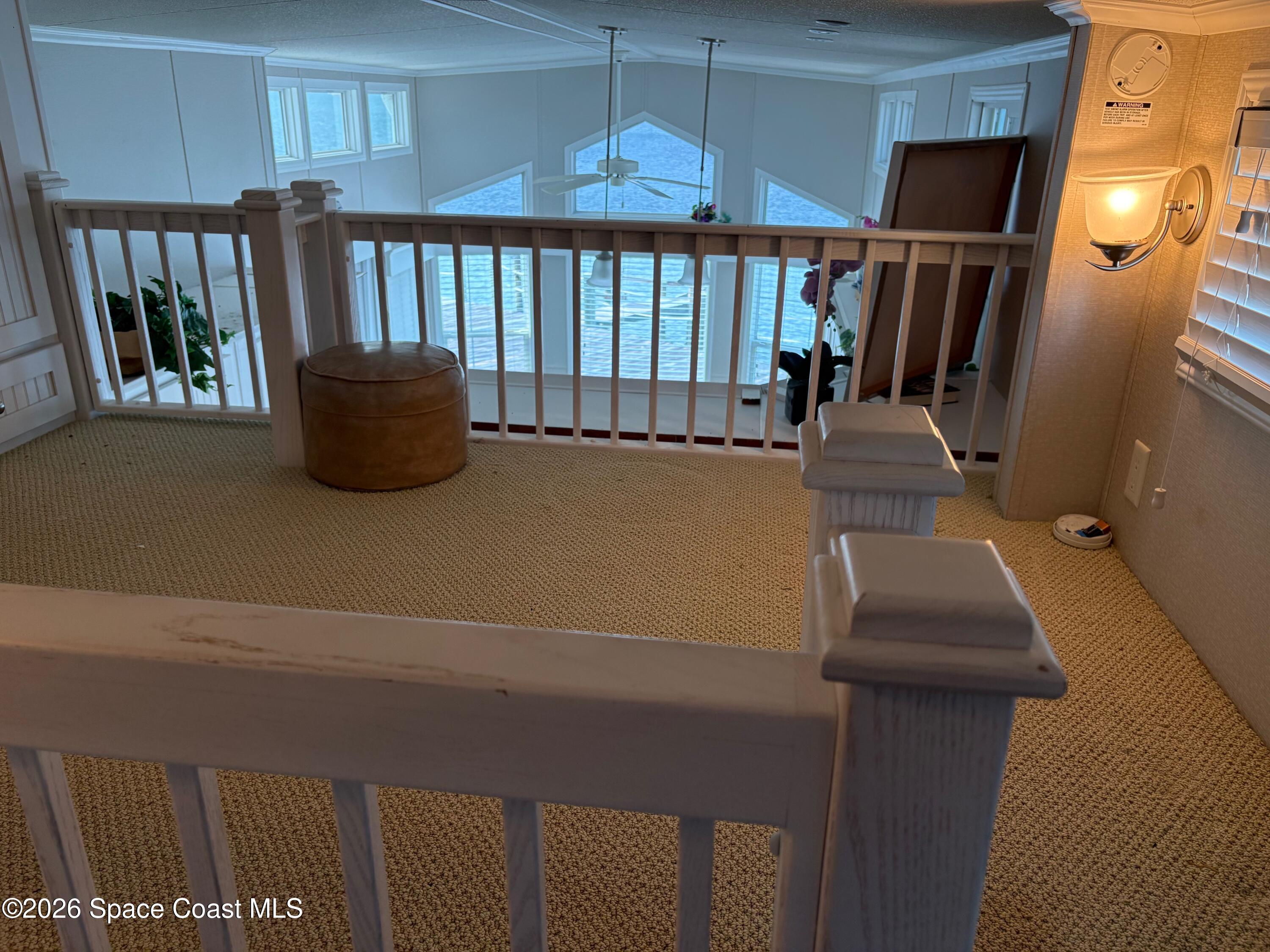 2912 Dockside Lane, Unit 2 Melbourne Beach, FL 32951 - Photo 41 of 66 a view of entryway and hall with wooden floor