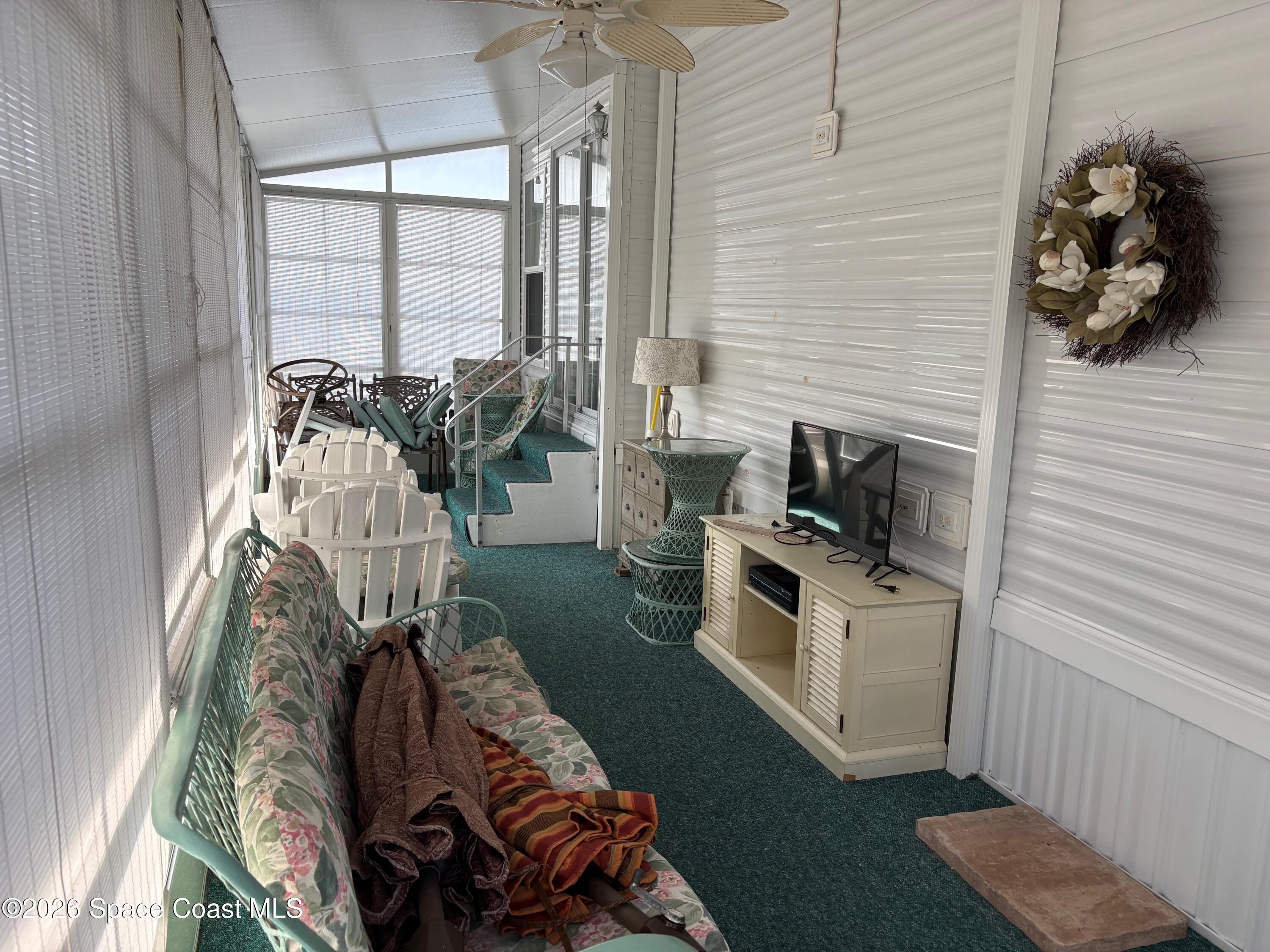 2912 Dockside Lane, Unit 2 Melbourne Beach, FL 32951 - Photo 48 of 66 a living room with furniture and a window