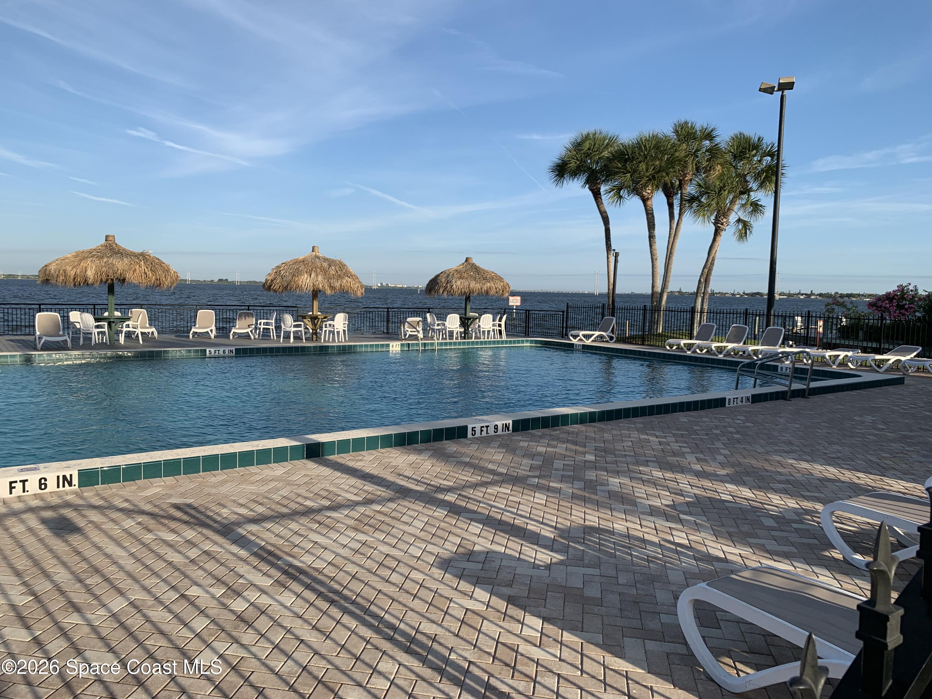 2912 Dockside Lane, Unit 2 Melbourne Beach, FL 32951 - Photo 63 of 66 a view of a lake with houses