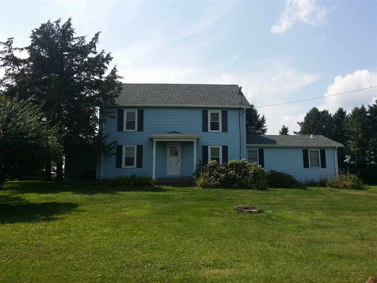 5793 Town Line Road Leaf River, IL 61047 - Photo 1 of 11 a front view of house with yard and green space