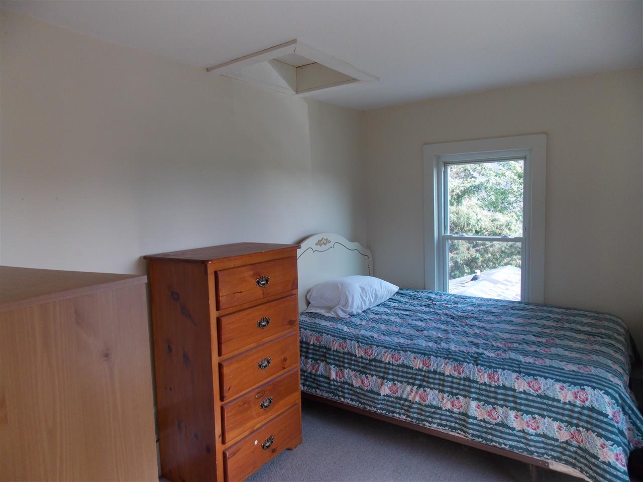 5793 Town Line Road Leaf River, IL 61047 - Photo 6 of 11 a bedroom with a bed and a window