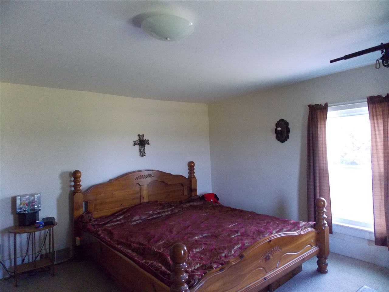 5793 Town Line Road Leaf River, IL 61047 - Photo 8 of 11 a bedroom with a bed and window