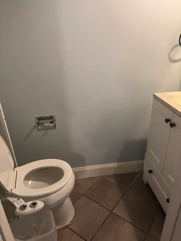 a bathroom with a toilet and a sink