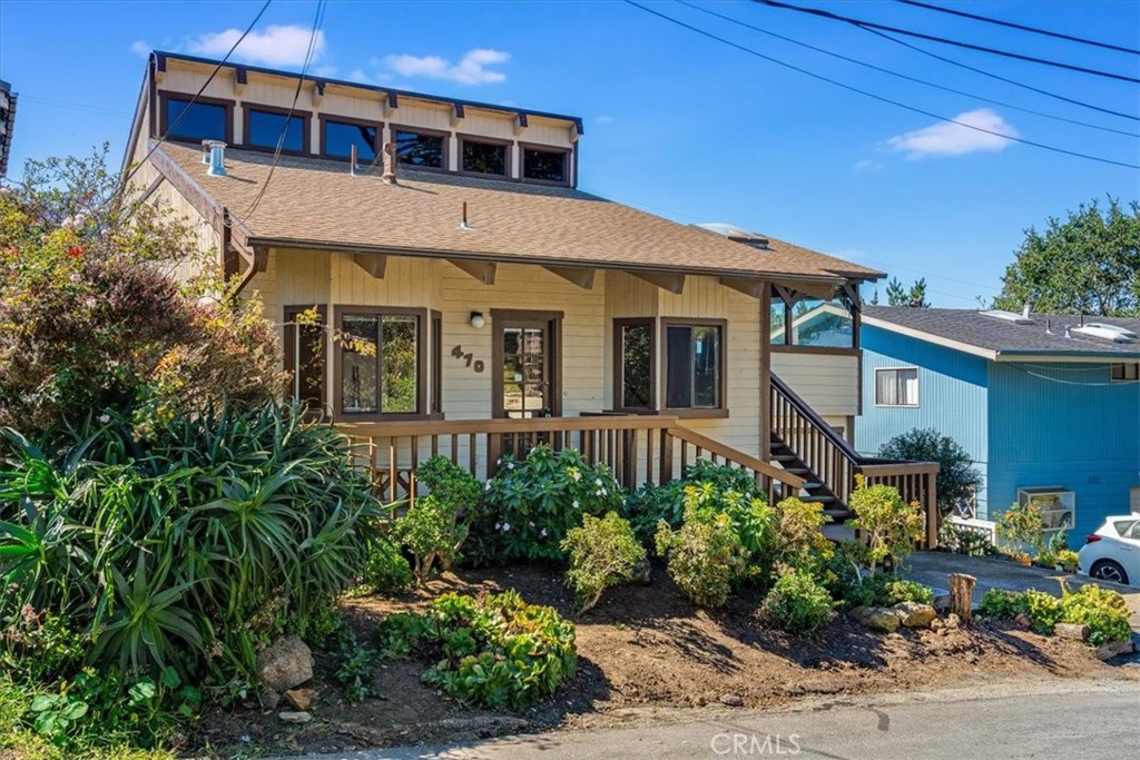 470 Warwick Street Cambria, CA 93428 - Photo 1 of 47 a front view of a house with plants