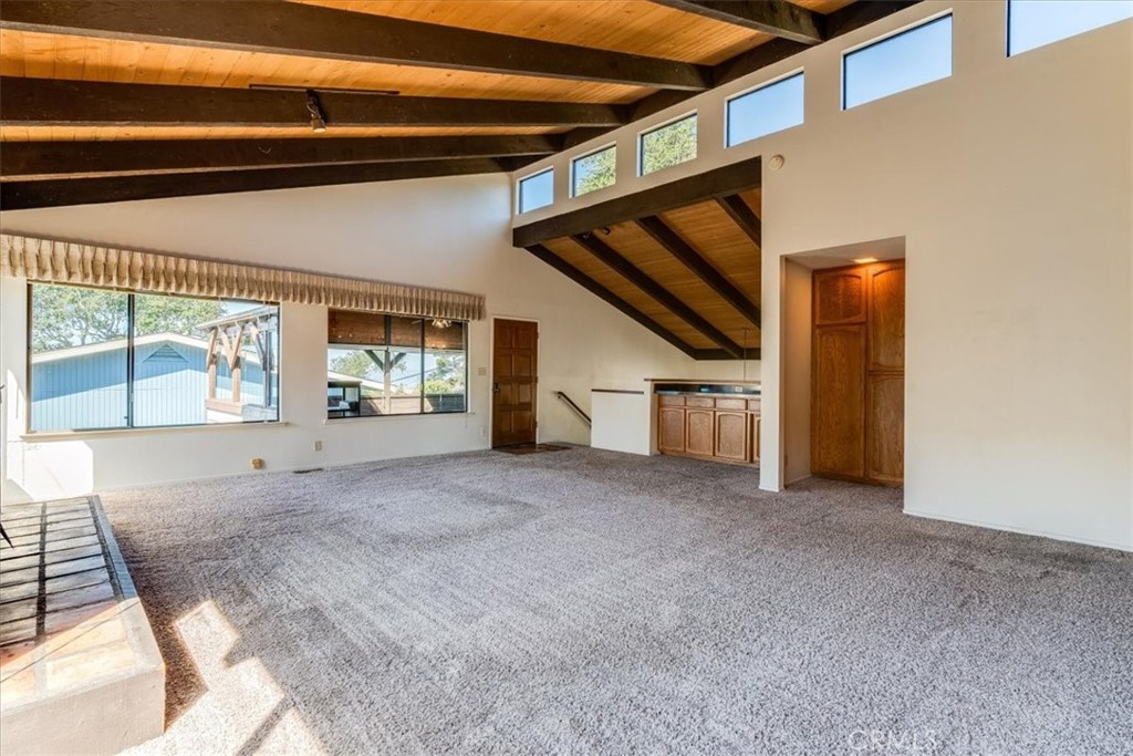 470 Warwick Street Cambria, CA 93428 - Photo 22 of 47 a view of empty room with wooden floor and fan