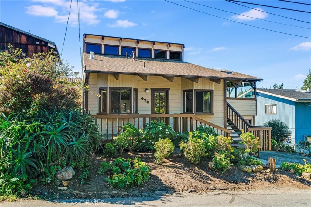 470 Warwick Street Cambria, CA 93428 - Photo 3 of 47 a front view of a house with a yard