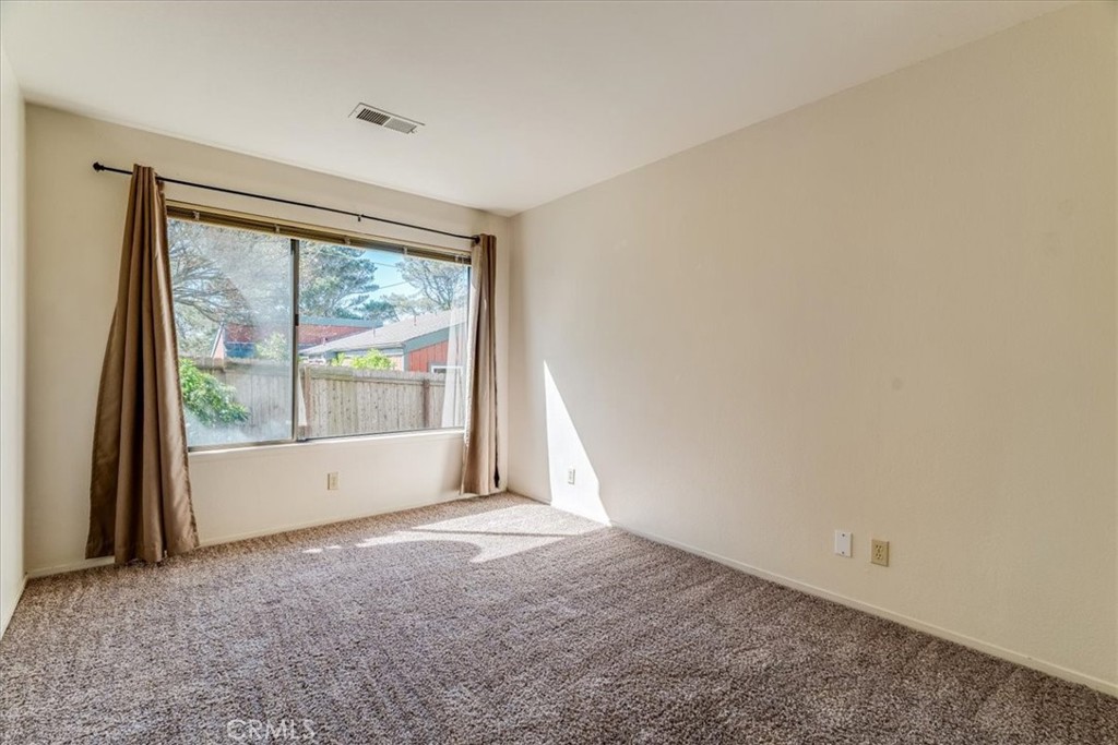 470 Warwick Street Cambria, CA 93428 - Photo 33 of 47 an empty room with large windows