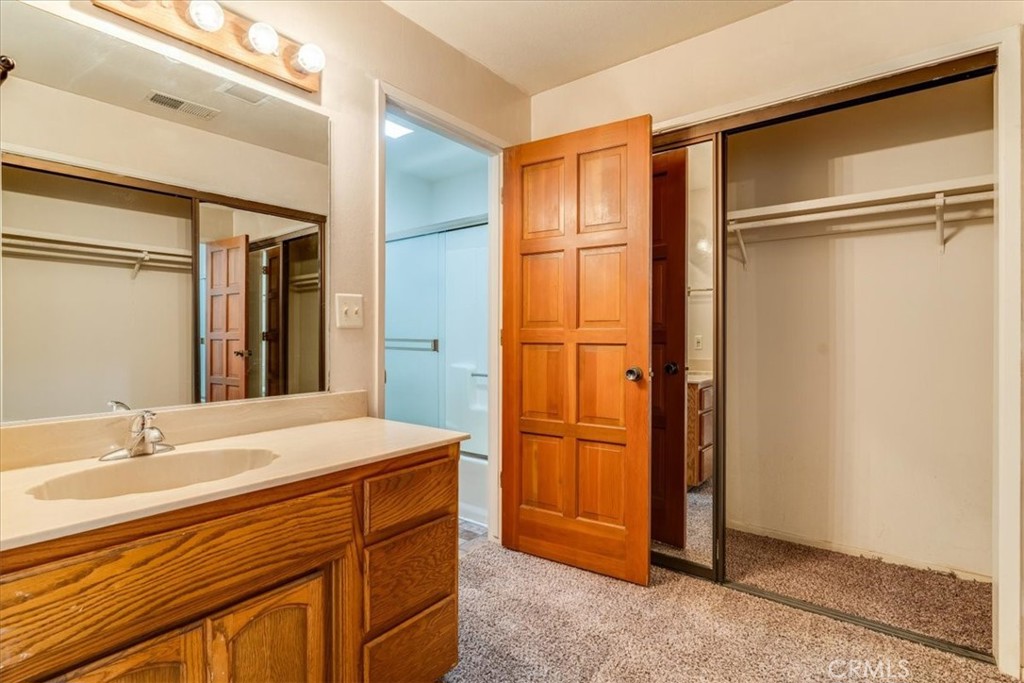470 Warwick Street Cambria, CA 93428 - Photo 38 of 47 a bathroom with a sink and a mirror