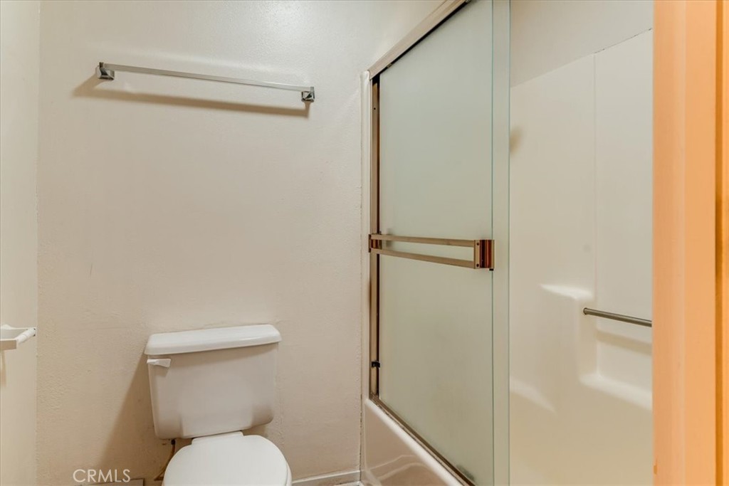 470 Warwick Street Cambria, CA 93428 - Photo 39 of 47 a white toilet sitting next to a shower