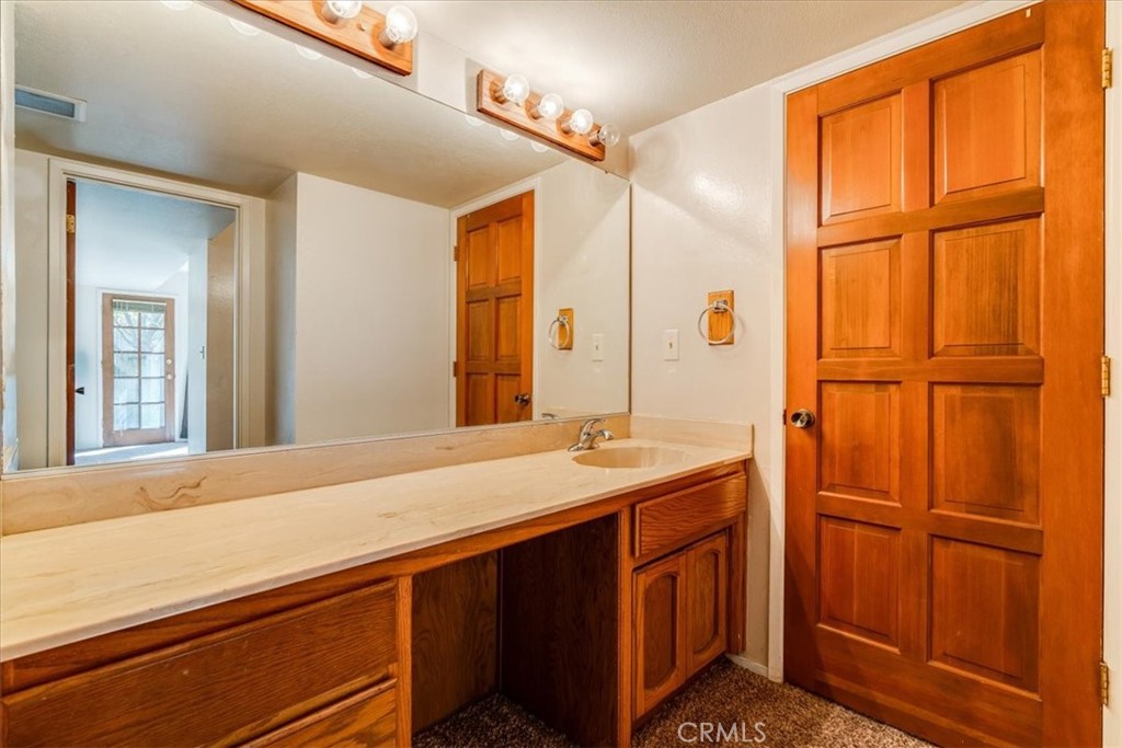 470 Warwick Street Cambria, CA 93428 - Photo 42 of 47 a bathroom with a sink and a mirror