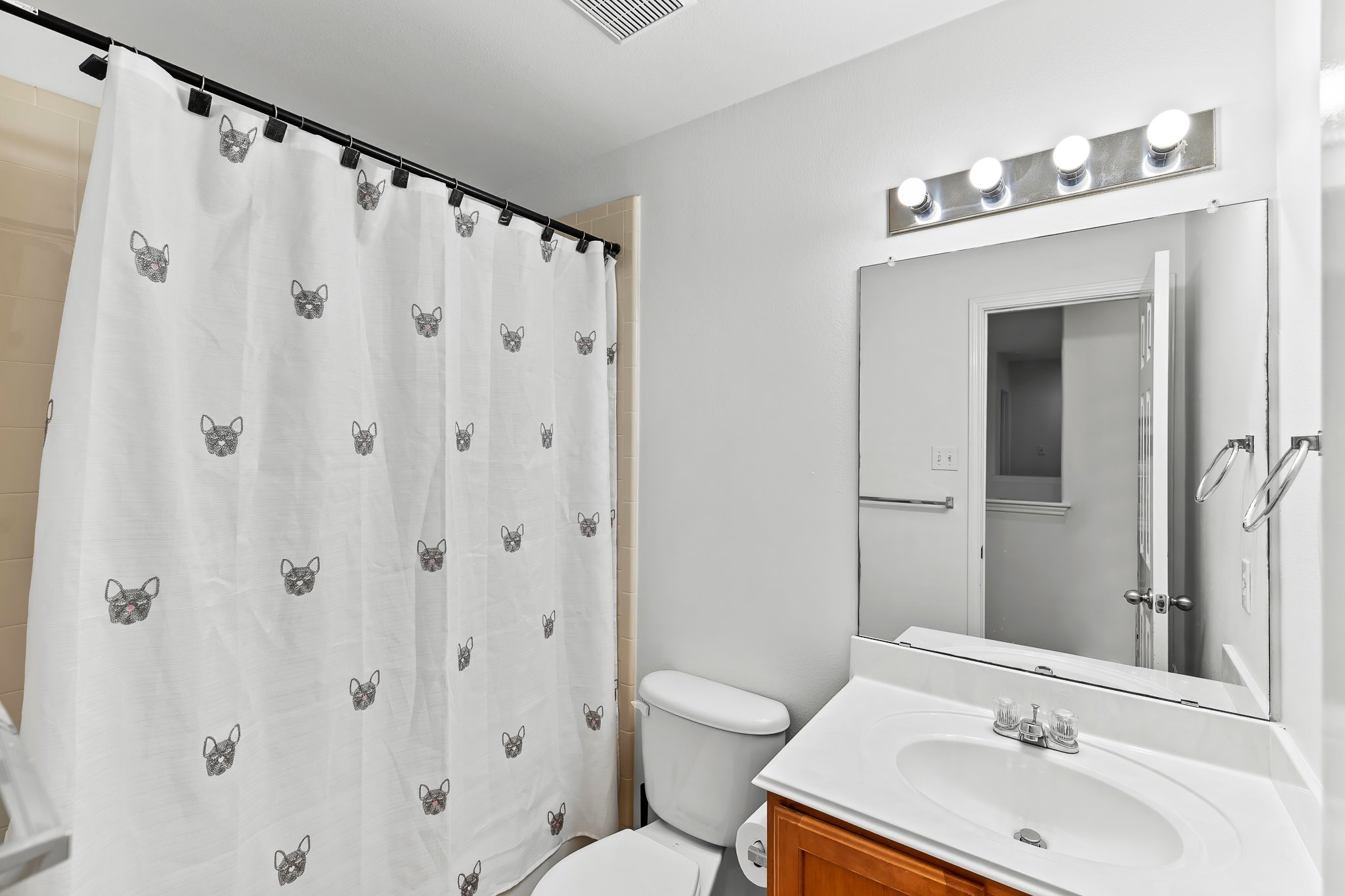 6700 Tulloch Way Austin, TX 78754 - Photo 33 of 39 a bathroom with a sink a toilet and a mirror