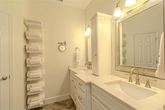 a view of walk in closet with clothes