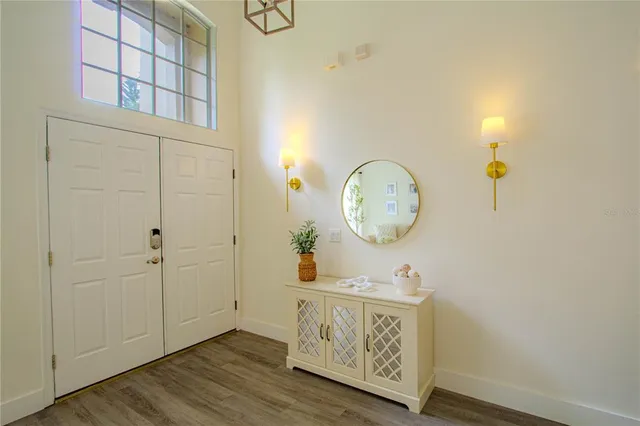 a view of an entryway with wooden floor