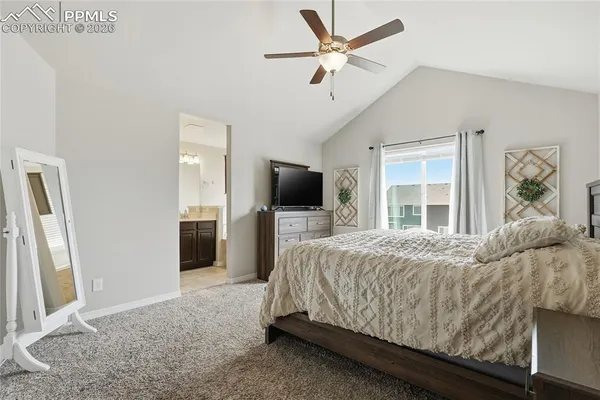 a bedroom with a bed and a table in it