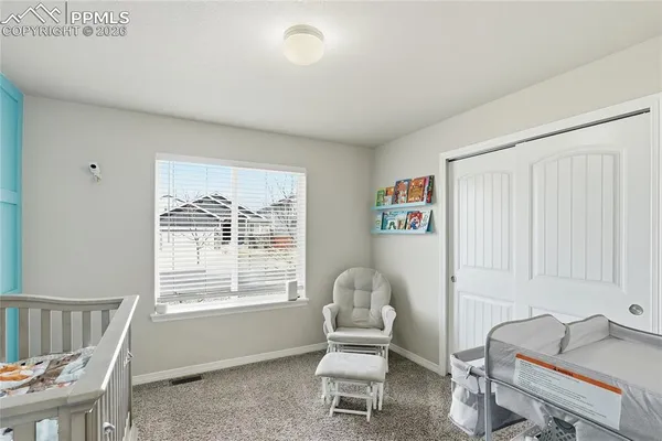 a view of a dining room with furniture and a flat screen tv