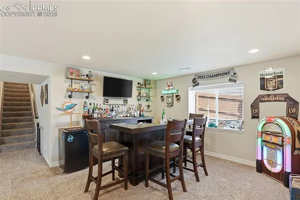 a front view of a house with large windows