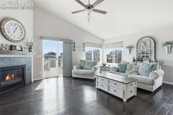 a living room with furniture and a fireplace