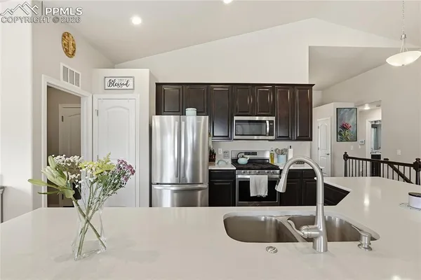 a bedroom with a bed and glass door