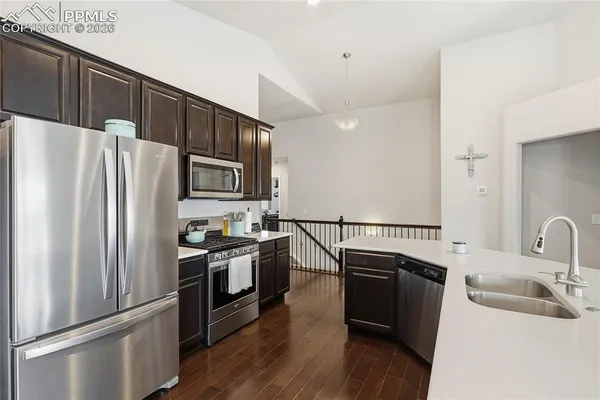 a bathroom with a sink double vanity granite tub and a mirror