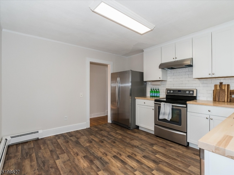81 Alexander Avenue, Unit 1 Montclair, NJ 07043 - Photo 8 of 15 a kitchen with a stove top oven and refrigerator
