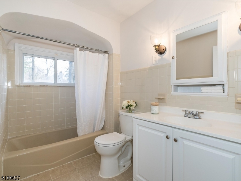 81 Alexander Avenue, Unit 1 Montclair, NJ 07043 - Photo 10 of 15 a bathroom with a sink a toilet and shower